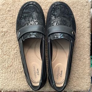 Clarks black slip on shoes